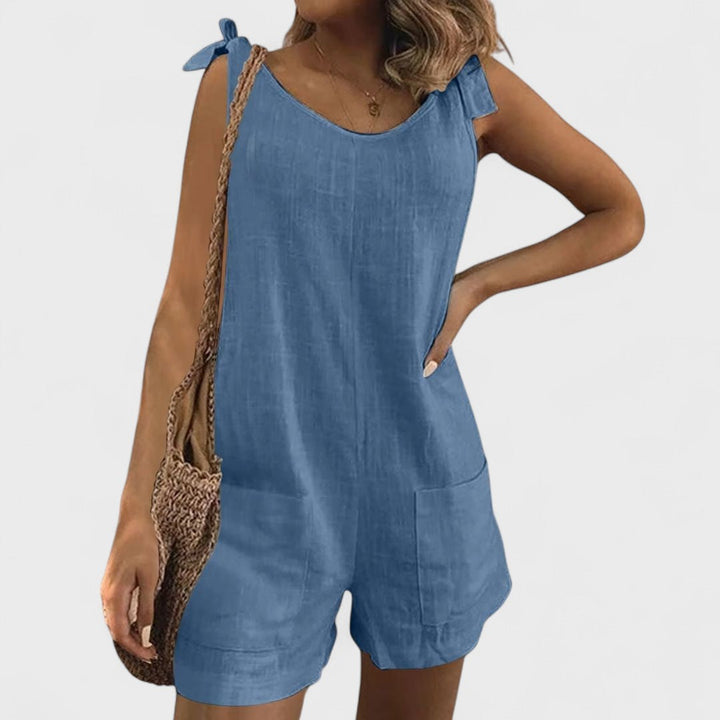Short jumpsuit with shoulder pockets and ties