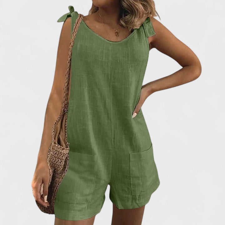 Short jumpsuit with shoulder pockets and ties