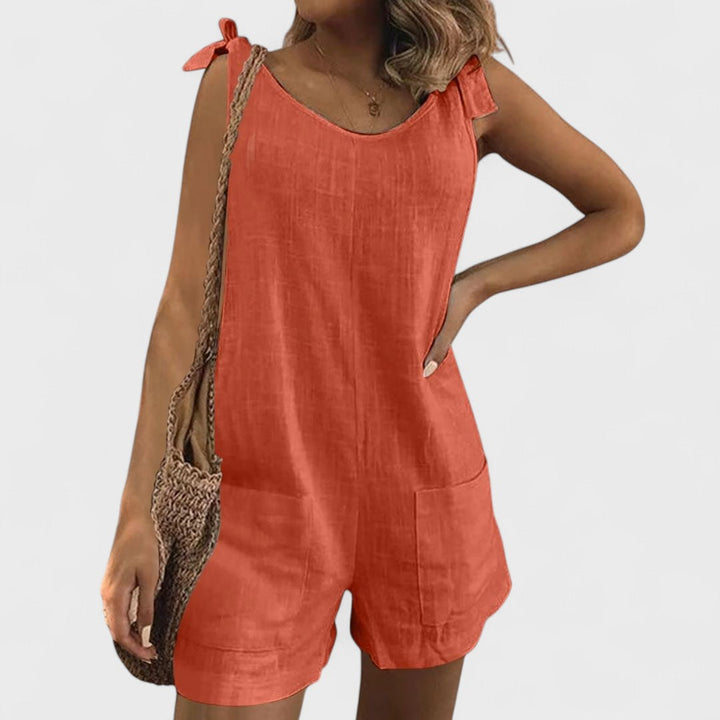 Short jumpsuit with shoulder pockets and ties